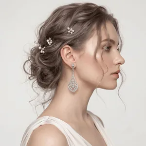 Elegant bridal rhinestone alloy drop earrings and pearl hair clips shown on a model