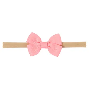 Diadema elástica de nylon para bebé con un lazo rosa de cinta de grano grueso