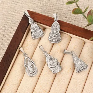 Silver-colored Buddhist pendants featuring Guanyin and Buddha figures on a jewelry tray