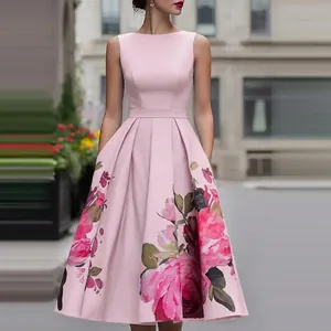 Close-up detail of a sleeveless pink floral dress featuring elegant waist pleats and a full skirt