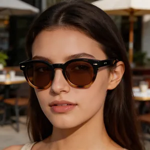 Professional close-up of a model wearing trendy oval frame sunglasses with tortoise gradient