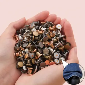 Versatile metal decorative pins for folding trouser legs shown in hands for pant styling