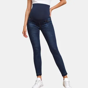 High-waisted skinny maternity jeans with supportive elastic belly band in dark blue