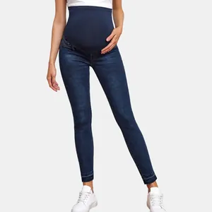 High-waist maternity skinny jeans with elastic belly support band and frayed hem