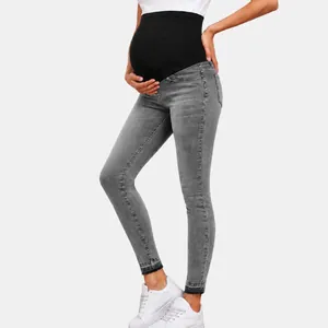 Side view of grey maternity skinny jeans with high waist over-the-belly support panel
