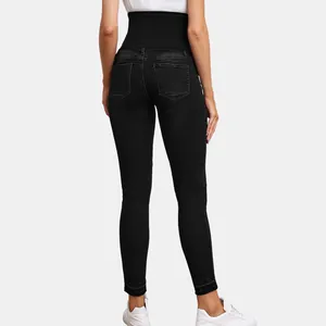 Detail back view of black maternity skinny jeans with high-waist support belly band