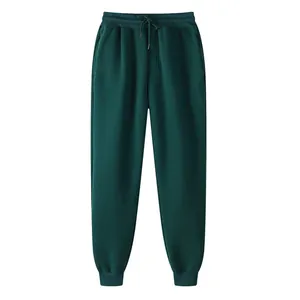 Pantalon de jogging pour hommes vert foncé doublé de polaire avec taille à cordon.