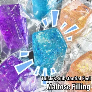 Macro detail of aurora ice cube squishy stress toy with glitter and maltose filling.