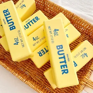 Macro view of realistic yellow butter stick squishy toys for stress relief