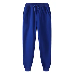 Pantalon de jogging bleu ajusté avec taille élastique à cordon et poignets.