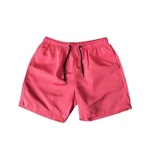 Men's vibrant pink summer casual beach shorts featuring an elastic drawstring waist