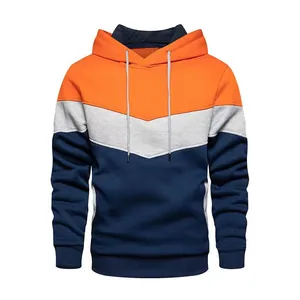 Detail view of a color-blocked orange, grey, and navy fleece pullover hoodie