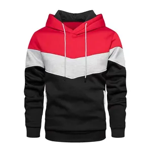 Close-up of men's tricolor block hoodie with red, grey and black chevron pattern detail.