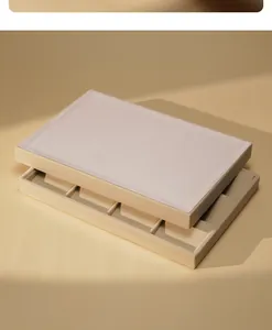 Detail view of a premium beige velvet jewelry organizer tray with soft texture.