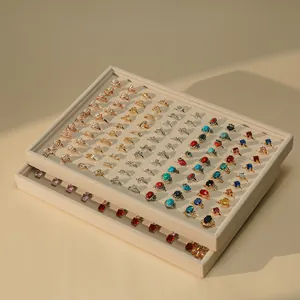 Premium beige velvet jewelry display tray with multiple slots for rings organization