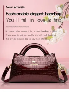 Elegant burgundy handbag with crocodile texture and polished patent leather finish