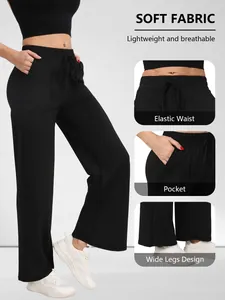 Detail van zwarte yoga broek met hoge taille, elastische tailleband en zakken.