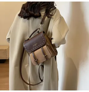 Elegant vintage two-tone leather backpack and crossbody bag for stylish casual outings.