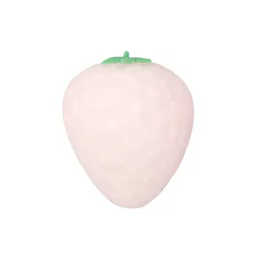 A color-changing pink strawberry squeeze toy designed for stress relief, white background