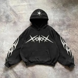 Men's oversized black hoodie with white tribal and star graphic prints.