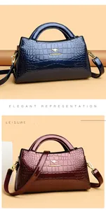 Elegant crocodile pattern patent leather handbags in blue and burgundy variants.