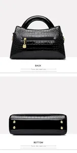 Back and bottom views of a black crocodile embossed patent leather handbag for women