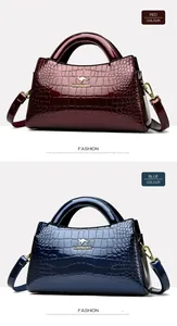 Detail showing glossy crocodile pattern patent leather handbags in red and blue colors