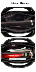 Detailed view of the internal compartments in the black patent leather handbag.