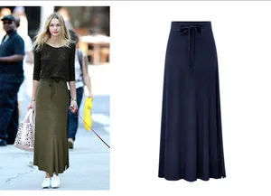 Detail view of a high-waist drawstring maxi skirt with side slit in navy blue color