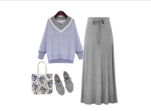 Coordinated outfit set featuring a grey high-waisted midi skirt with a side slit