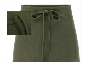 Detail macro view of olive green ribbed knit skirt waist with drawstring bow knot
