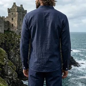 Back view of men's navy blue vintage linen long sleeve henley shirt with castle backdrop