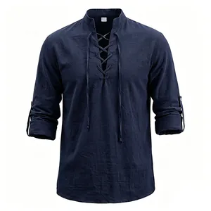 Detail of men's navy blue linen lace-up Henley shirt with stand collar and textures