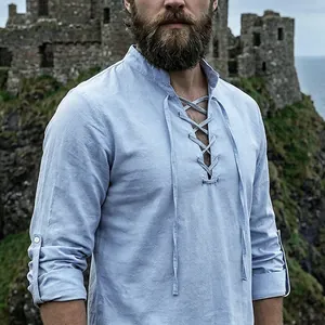 Close-up of men's vintage light blue linen henley shirt with lace-up neck detail