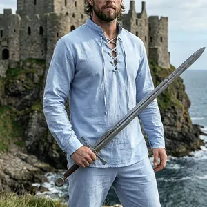 Men's light blue medieval linen henley shirt with lace-up collar in a castle setting