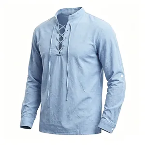 Detail view of light blue linen Henley shirt with stand collar and front lace-up design.