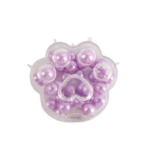 Creative cat paw squishy fidget toy filled with lustrous purple pearl beads for stress relief.