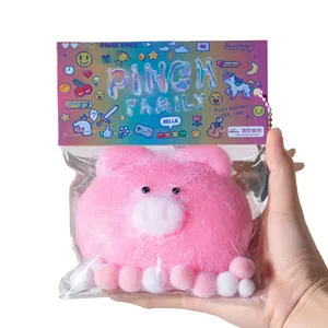 Adorable pink fuzzy pig pinch stress relief toy in vibrant Pinch Family packaging