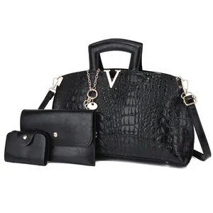 Elegant black crocodile embossed handbag set with gold V hardware and chain strap.
