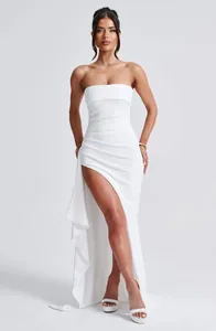Detailed view of elegant white strapless maxi dress with side split and ruched waistline