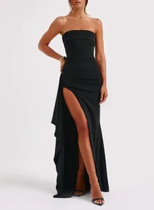 Elegant black strapless maxi dress featuring a high side slit and sophisticated draped detail