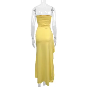 Back view of sexy yellow strapless maxi dress with side slit and irregular hem design