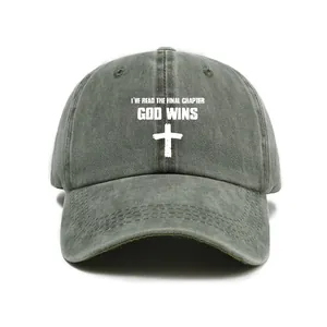 Detailed macro view of washed cotton baseball cap with God Wins text and cross design