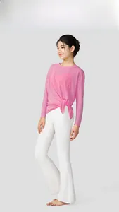 Side view of a breathable pink slub yarn yoga top featuring a side knot detail design