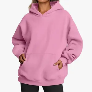 Detail view of the pink oversized women's hoodie featuring a spacious kangaroo pocket.