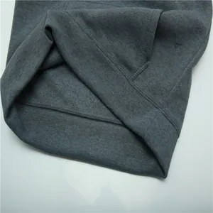 Close-up detail of dark grey women's oversized hoodie stitching and fabric texture