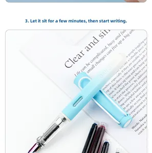 Close-up view of a blue fountain pen with 3.4mm replaceable ink cartridges on paper