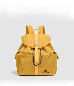 Front view of a vibrant yellow minimalist college-style backpack for school and commuting