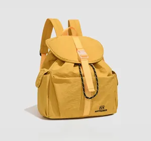High-quality side detail of a minimalist ginger yellow college style commuter backpack