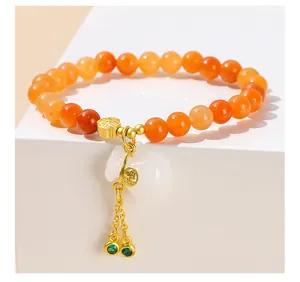 Bracciale di perle in avventurina rossa naturale con ciondolo a sacchetto in giada bianca
